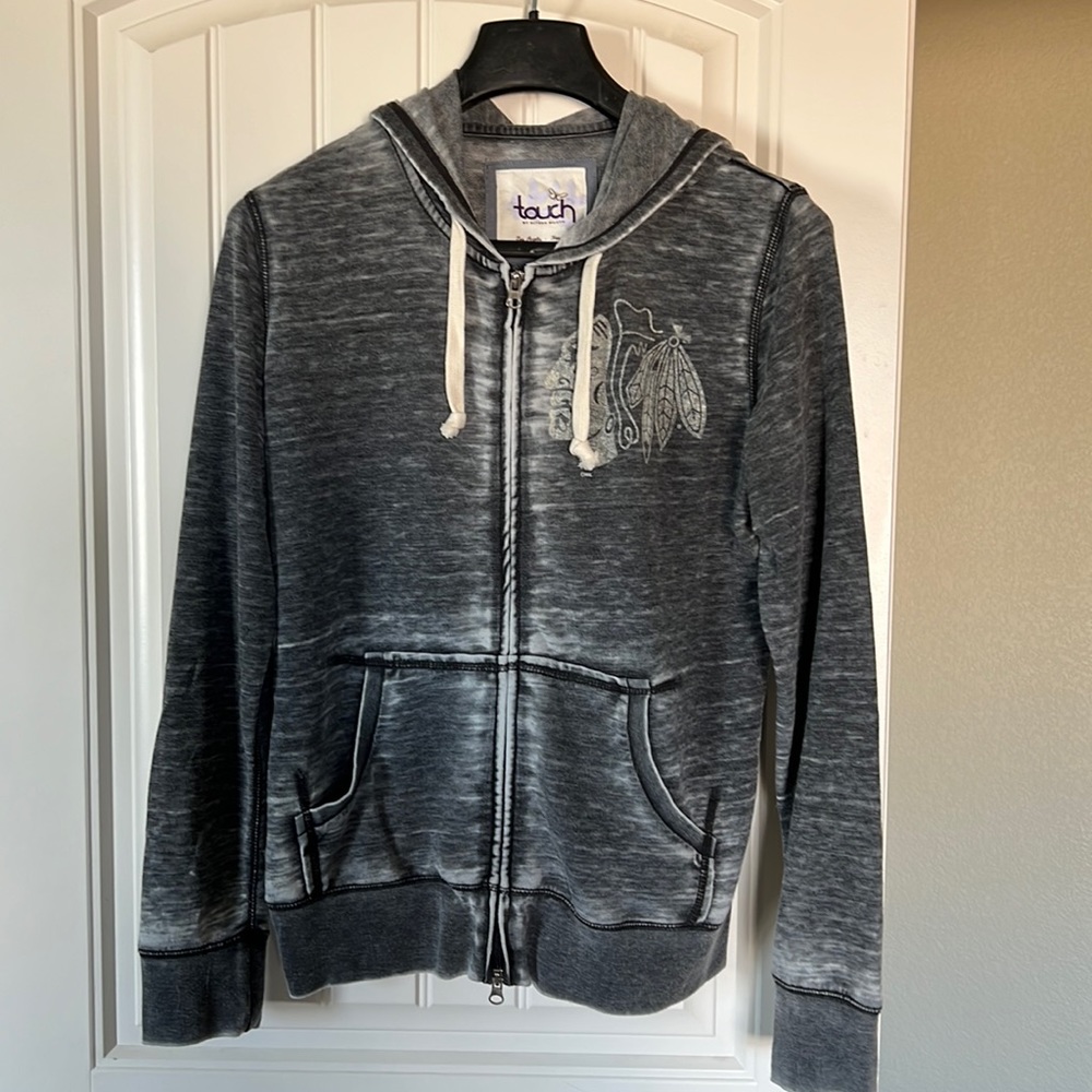 Brand new. Never worn. Chicago Blackhawks Double zipper sweater.